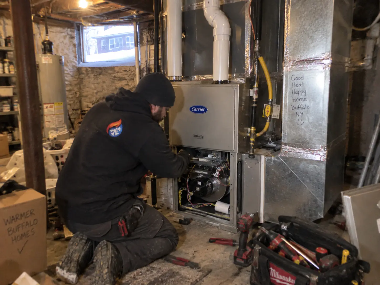 Furnace burner assembly being serviced during a residential repair
