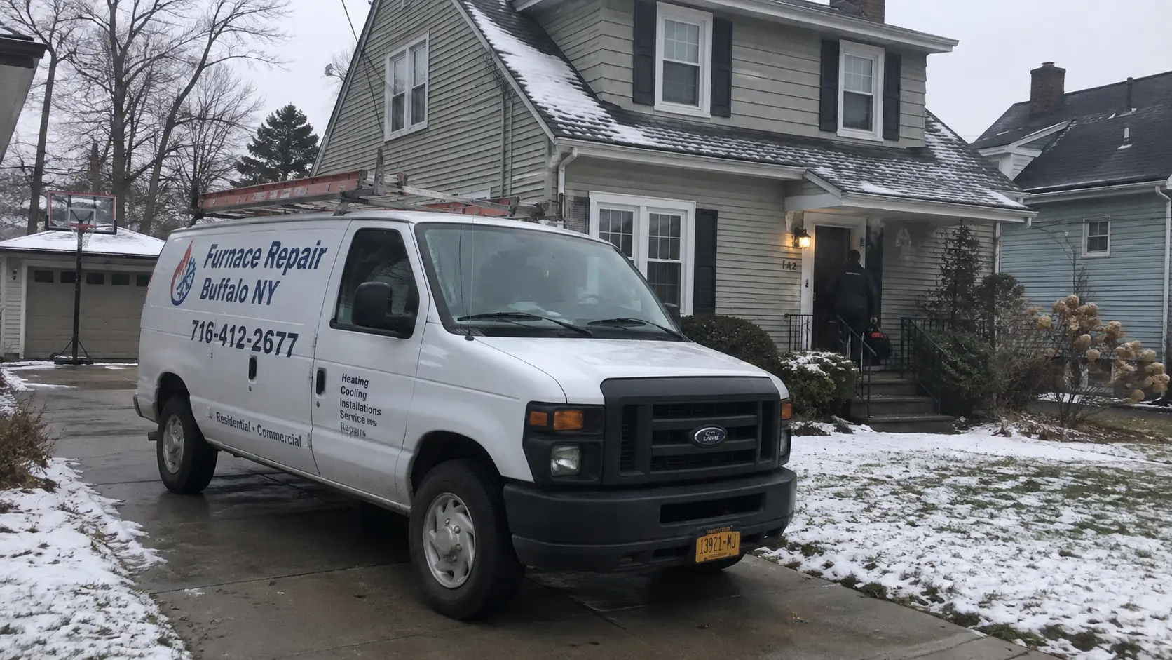 Furnace Repair Buffalo NY service van outside a snow-covered Western New York home
